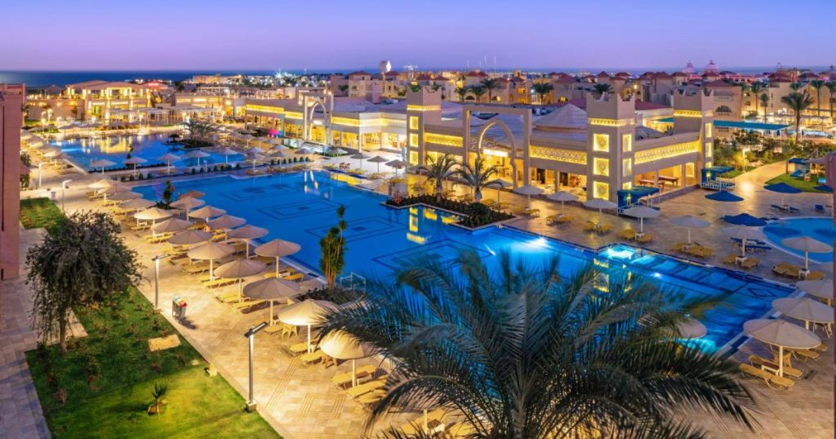 Evening view of the Hurghada resort pools and illuminated all-inclusive hotel complex