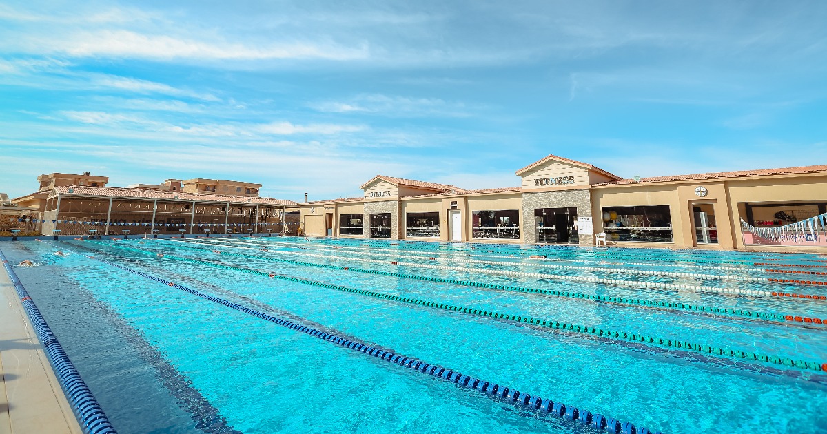 Outdoor 50m Olympic swimming pool with lane ropes at a Red Sea resort training facility in Hurghada, Egypt