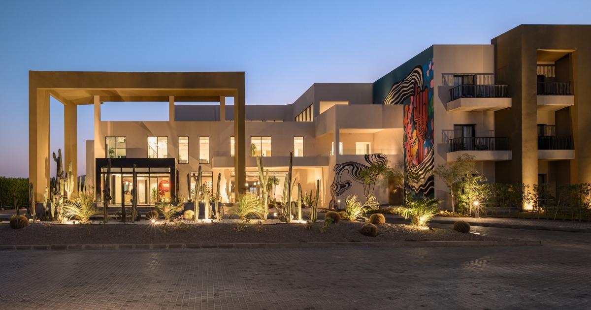 Kaktus Hotel building exterior illuminated at night, Soma Bay