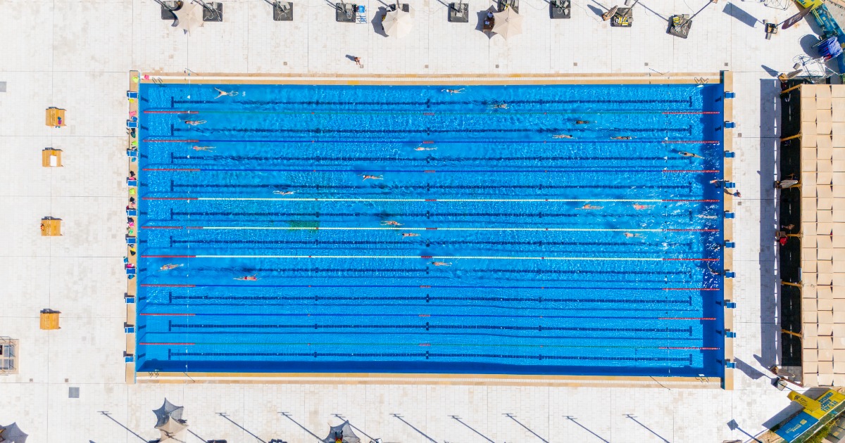 Swimmers diving into the Red Sea from the competition pontoon at Soma Bay