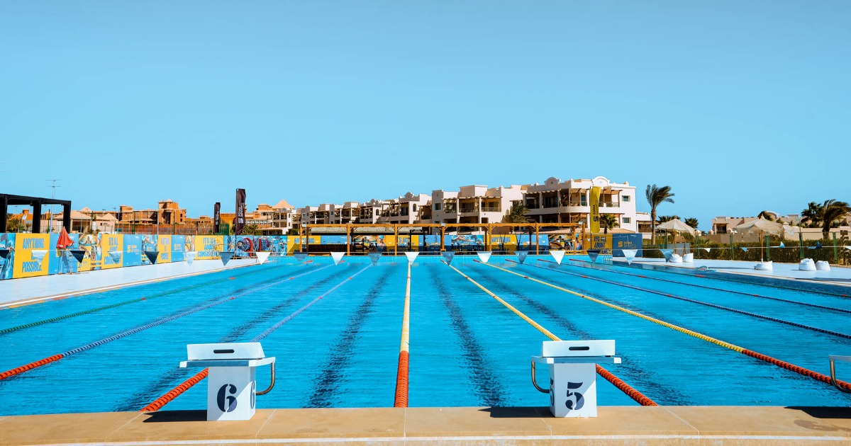 Soma Bay 50m pool — view from poolside showing starting blocks on lanes 6 through 9